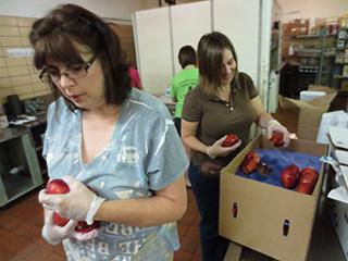 Hunger Coalition volunteers working in the Benedictine College Dining Hall kitchen